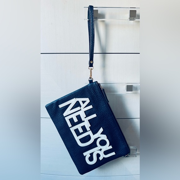 A navy blue shoulder and wristlet, adjustable strap to also wear as a crossbody - Picture 7 of 12